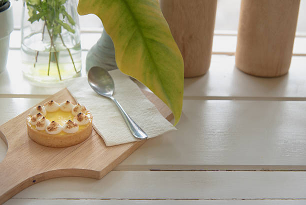 istock lemon tarts on wood plate 626951672