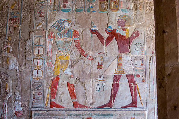 Luxor, Egypt - July 26, 2016: A relief sculpture and hieroglyphics on a wall of the Mortuary Temple of Hatshepsut in Luxor.