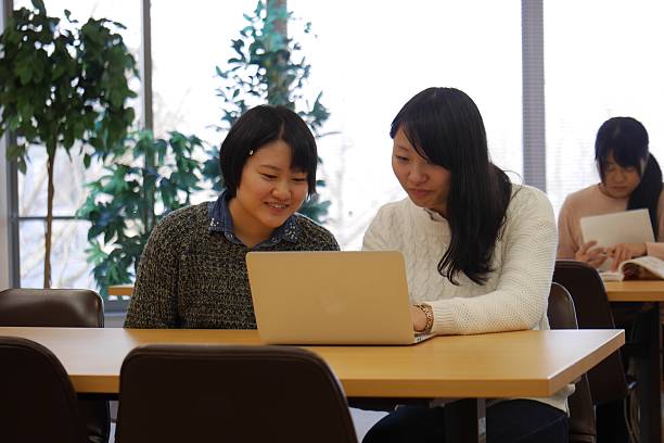 istock College Students are Discussinig at Library 626954510