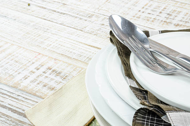 istock Blank plate with fork and knife on tablecloth background 626955188