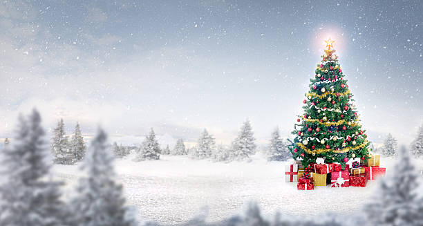 istock magic Christmas tree in snow outdoor 626957190