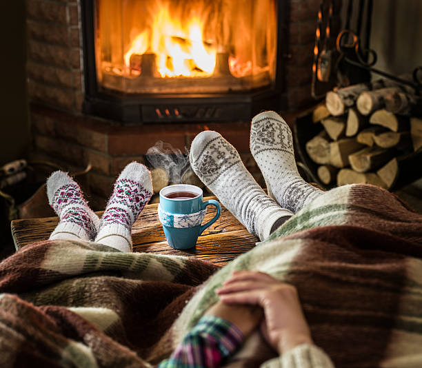 istock Warming and relaxing near fireplace. 626958502