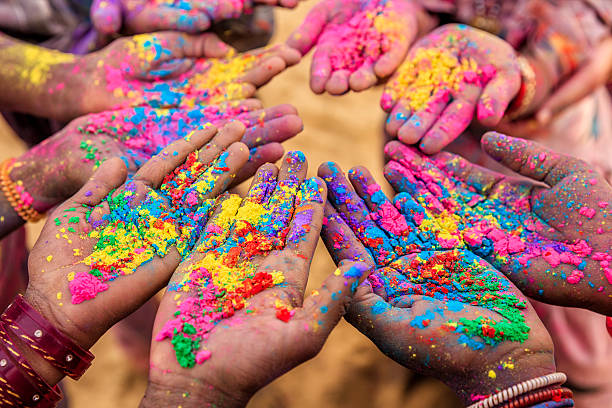 Group of Indian children playing holi in Rajasthan, India Group of Indian children playing happy holi in Rajasthan, India. Indian children keeping their hands up and showing colorful powders. Holi, the festival of colors, is a religious festival in India, celebrated, with the color powders, during the spring. holi stock pictures, royalty-free photos & images