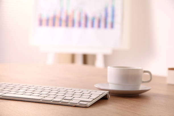 istock office desk with a computer and  cup of coffee 626962122