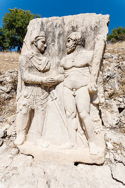 istock King Mithridates shaking hands with Herakles. 626964214