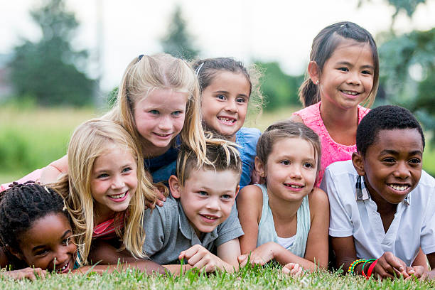 istock Group of Children Lying in the Grass 626964644
