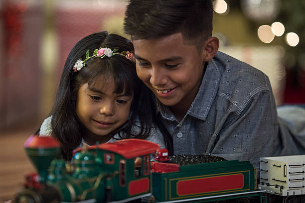 istock Siblings Playing with a New Toy Train 626965824