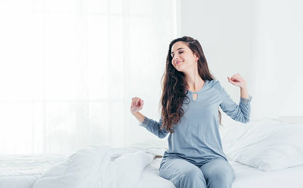 istock Girl waking up and stretching 626965918