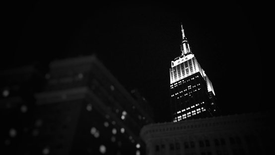 night shot of the Empire State Building in black and white