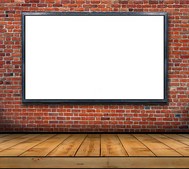 istock One big blank billboard attached to a brick wall inside 626966758