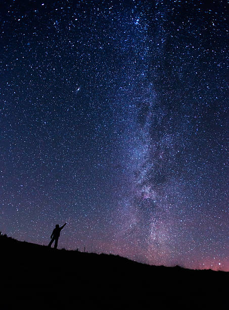 istock Lonely man under the starry sky 626996760