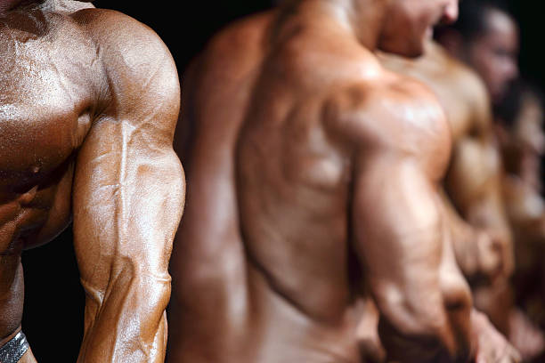 bodybuilders - chest sweat male pectoral muscle ストックフォトと画像