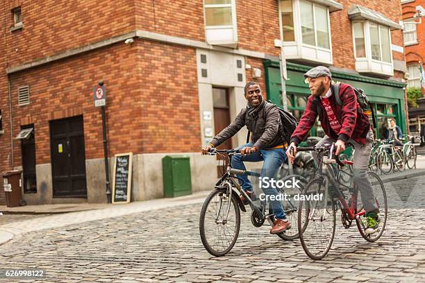 Mixed Race Gay Couple With Bicycles In The City Stock Photo - Download Image Now - Dublin - Republic of Ireland, Friendship, City