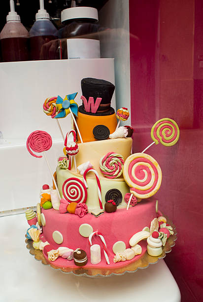 A collection of elegant desserts is artfully arranged on a reflective surface. A variety of exquisite pastries and desserts are presented before your eyes, showcasing vibrant colors and creatively designed presentations, making them perfect for special occasions or celebrations.