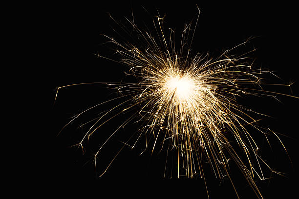 istock New year party sparkler closeup on black background 626998366