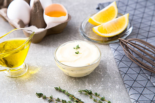 istock Fresh homemade white sauce Mayonnaise and ingredients 627000038