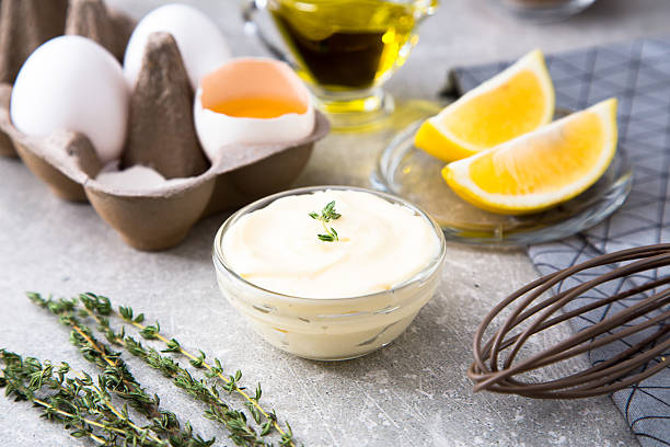istock Fresh homemade white sauce Mayonnaise and ingredients 627000112