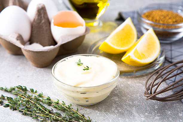 istock Fresh homemade white sauce Mayonnaise and ingredients 627000182