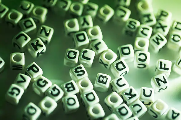 Photo of cubic letter random on surface