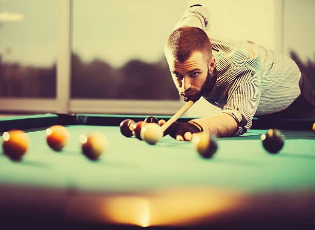 istock Vintage image of pool player in plaid shirt 627000718