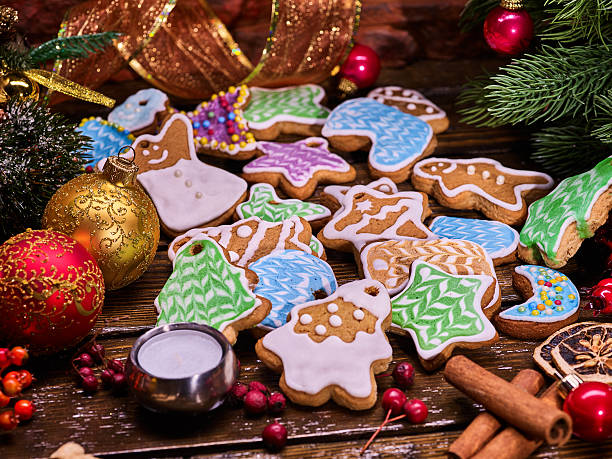 istock Christmas gingerbread cookies on woden table and candels. 627000804