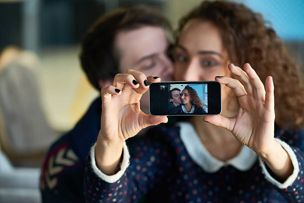 istock Young couple taking lovely selfie 627001490
