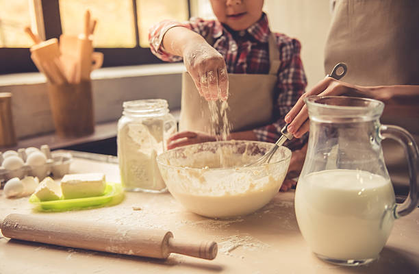 istock Mom and daughter baking 627001500