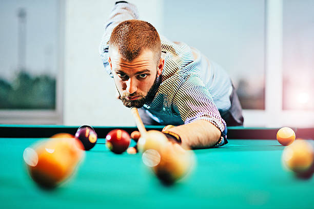 istock Portrait of billiard player aiming 627001550