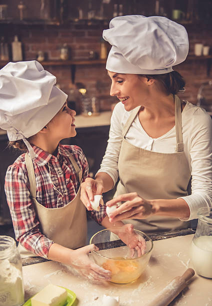 istock Mom and daughter baking 627002106