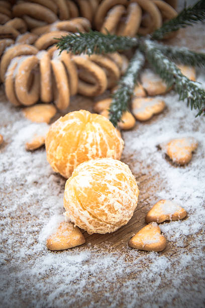 istock tangerines in snow on a wooden table, new year 627003656