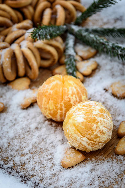 istock tangerines in snow on a wooden table, new year 627003762