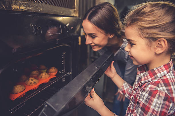 istock Mom and daughter baking 627003960