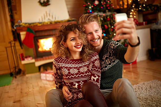 istock Male and female taking selfie 627008854
