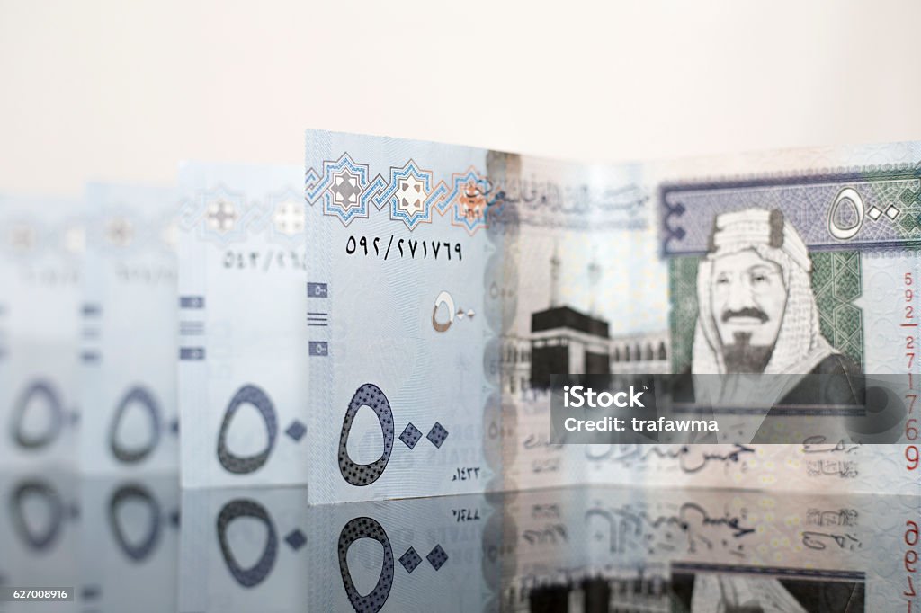Saudi All Notes Multiple Saudi Notes On A Dark Glass Stock Photo - Download Image Now ...