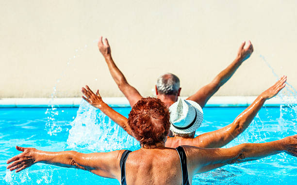 istock Active seniors getting a workout at the swimming pool 627009198