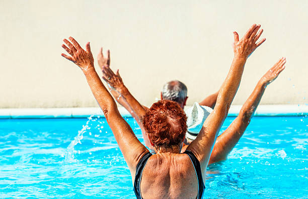istock Active seniors getting a workout at the swimming pool 627009220