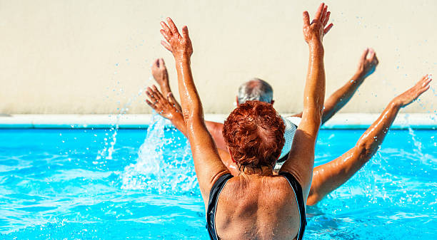 istock Active seniors getting a workout at the swimming pool 627009264