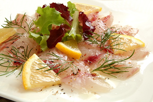 Carpaccio of seasonal fish (threeline grunt), greens, dill, lemon, olive oil and garlic