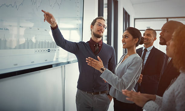 istock Discussing business strategies with his team 627013526