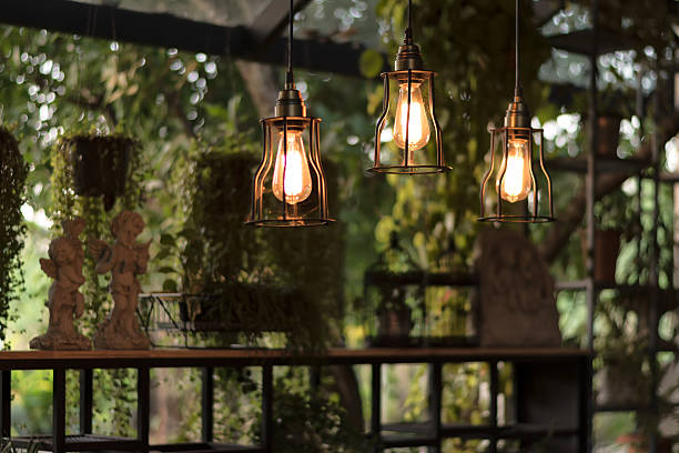 istock beautiful Light bulb incandescent hanging decorated interior roo 627013532