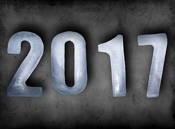 istock New Year numbers 2017 as ice cubes on dark wall 627014188