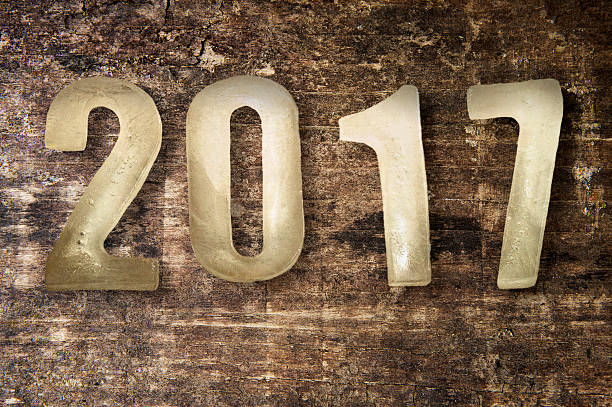 istock New Year numbers 2017 on wooden background 627020566