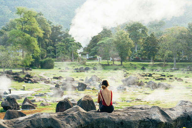 istock Woman looking at the valley with hot springs 627020930
