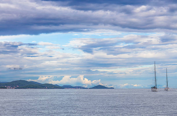 istock Sail boats on sea with cloudy sky 627021014