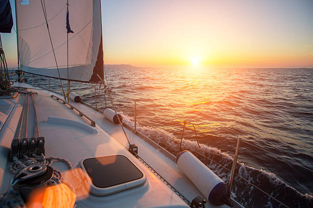 istock Sailing ship yachts in the open Sea during fantastic sunset. 627021434