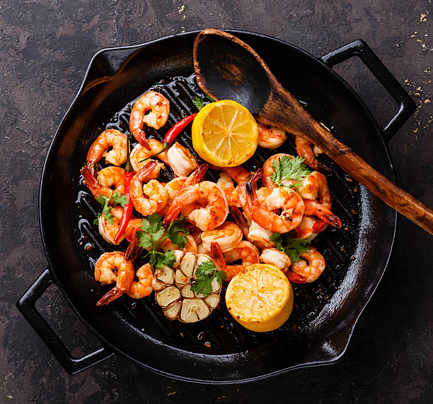 istock Prawns roasted on frying pan 627023672