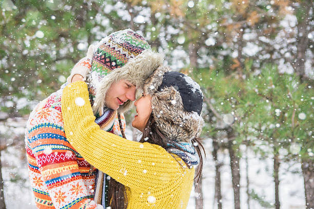 istock Loving couple in the winter park 627023904