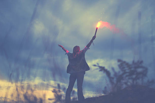 istock Girl with flaming torch 627029200
