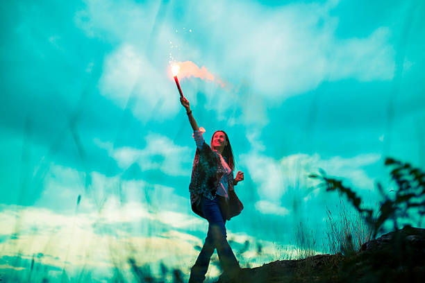 istock Woman with flaming torch 627029232