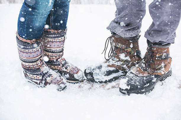 istock Loving couple in the winter park 627029348